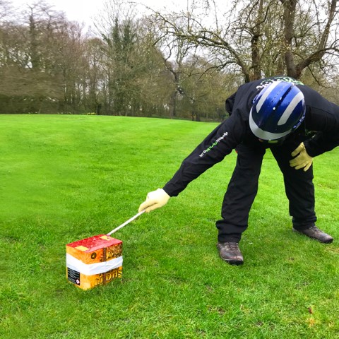 Ensuring no part of your body is over the firework, standing sideways, at arm's length light the outermost end of the fuse and retire immediately to the stated distance on the firework label.