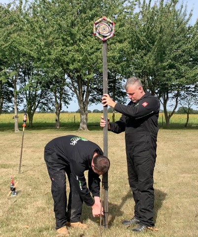 Attach securely to an upright post (using the nails supplied) through the hole in the centre of the wheel.