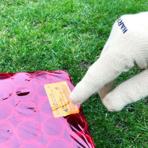 Locate 1st fuse, signified by the words FUSE or FIRST FUSE UNDER THIS COVER or by the number 1. (Some fireworks now contain 2 fuses.)